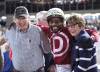 Jason Halstead / Assiniboia Photo
                                Owner Gary Danelson (left), jockey Antonio Whitehall (centre) and owner Bonnie McCrory celebrate in the winner’s circle after winning the Winnipeg Futurity with Omaha Warrior.