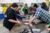 MIKE DEAL / FREE PRESS 
                                Autumnlee (left) shows Patrick Taggart, instructional assistant in the industrial mechanic/millwright program her progress making a brass ring on Wednesday in Winnipeg.