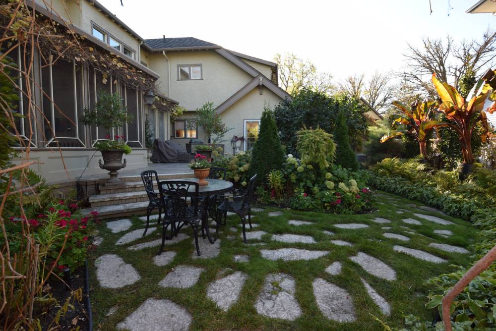 Todd Lewys / Free Press
Paradise awaits at the back of the home with a backyard with outdoor kitchen, patio, eating area, gorgeous landscaping and an attached backyard featuring a water fountain and gazebo.