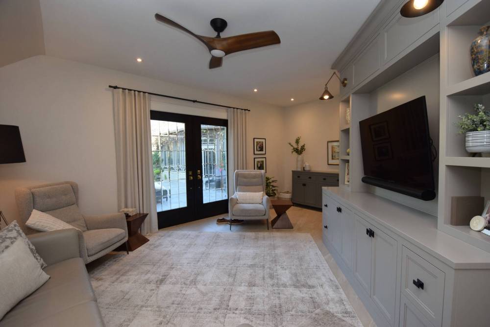 Todd Lewys / Free Press
Tucked away at the rear of the home, the main-floor family room is a quiet spot to watch TV or to step out the door to a huge patio to admire the park-like backyard.