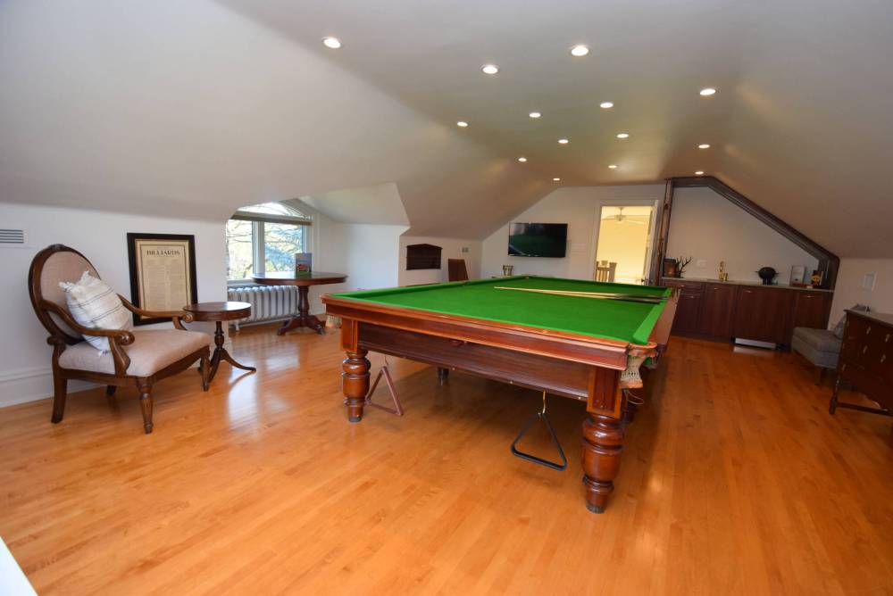 The wet bar and vintage billiards table in the game room will have game lovers rejoice.