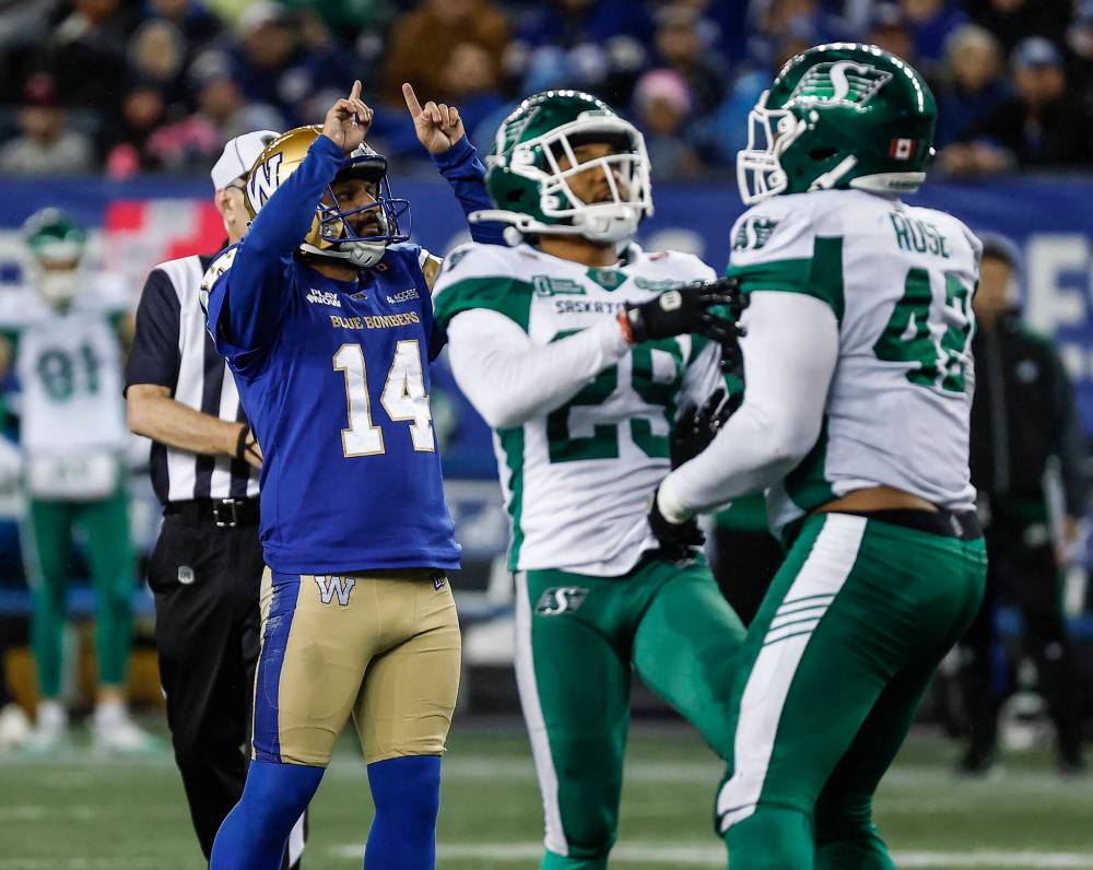 John Woods / THE CANADIAN PRESS
Blue Bombers kicker Sergio Castillo (left) celebrates his game-winning field goal Friday against the Saskatchewan Roughriders.