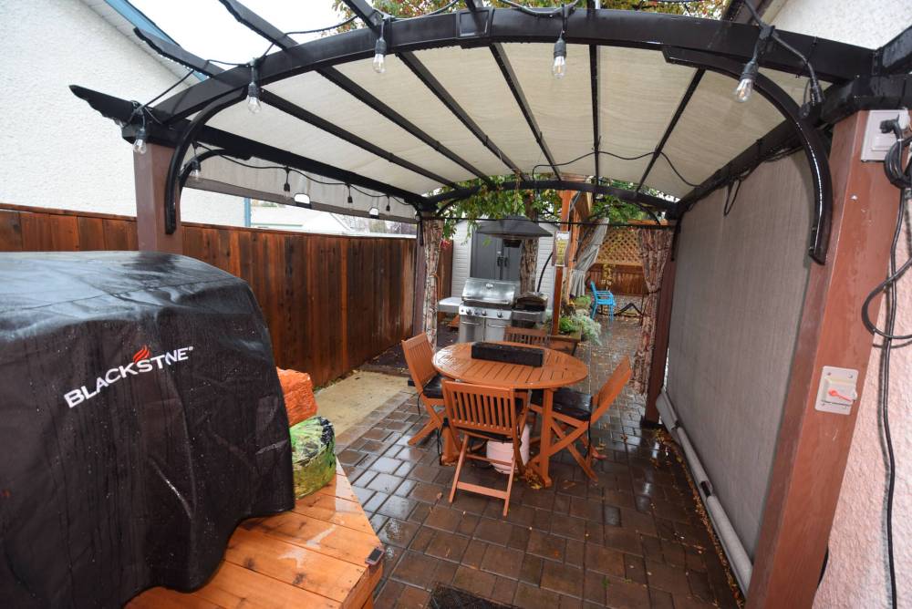 TODD LEWYS / FREE PRESS
The fabulous backyard starts off with a pergola area and patio and branches out into another patio plus a firepit, cat run and shed.