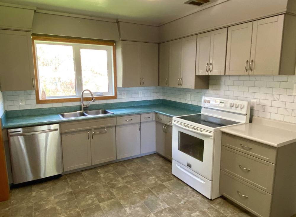Marc LaBossiere / Free Press
A new peel-and-stick backsplash greatly improves a rental-property kitchen while adhering to a strict budget.