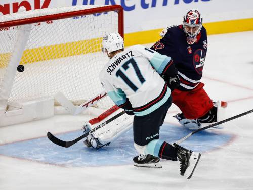 John Woods / THE CANADIAN PRESS
                                Seattle’s Jaden Schwartz scores the game-winning goal against Jets goalie Connor Hellebuyck on Thursday during the second period.