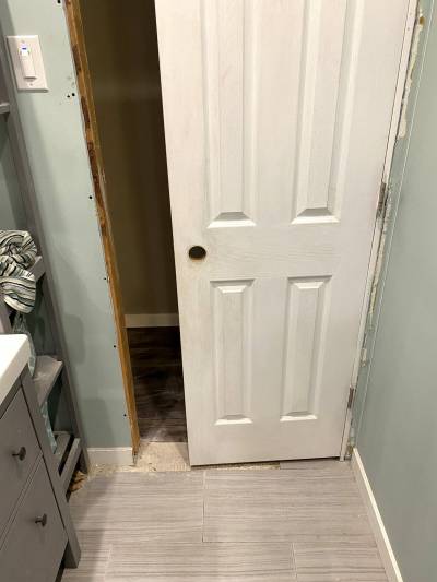 Once the opening was adapted, the old door highlights the width difference.