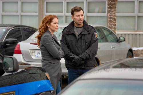 Panagiotis Pantazidis / Hallmark Media
                                Emily (Sarah Drew) and Sam (Peter Mooney) get romantic in Season 2 of Mistletoe Murders.