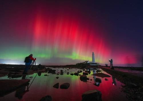 Owen Humphreys/ The Associated Press
                                The aurora borealis glow in the sky over St Mary’s Lighthouse in Whitley Bay on the North East coast, England.