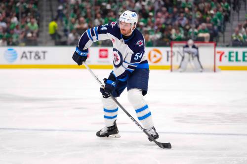 Julio Cortez / THE ASSOCIATED PRESS FILES
                                Winnipeg Jets defenceman Dylan Samberg was sidelined in the pre-season, breaking his wrist when he was checked into the glass by Calgary Flames winger Ryan Lomberg.