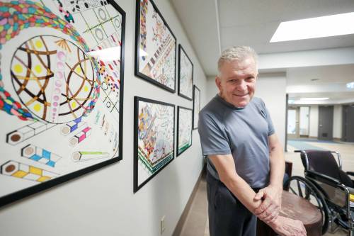 Ruth Bonneville / Free Press
                                Local artist and Riverview resident Andre Hall-Grusska creates intricate geometric designs, often using his bed as a standing desk.