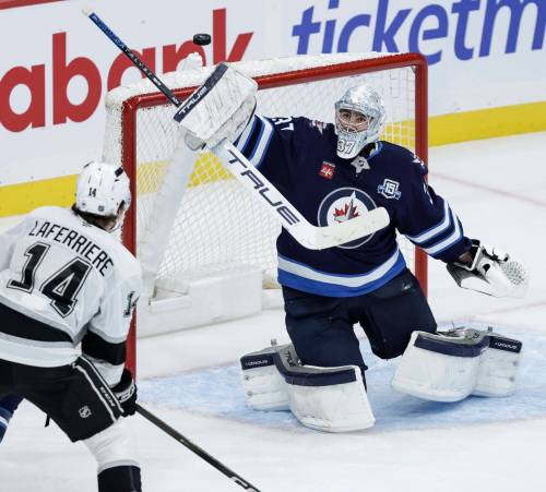 John Woods / THE CANADIAN PRESS FILES
                                Winnipeg Jets goaltender Connor Hellebuyck will be undergoing arthroscopic knee surgery Saturday.