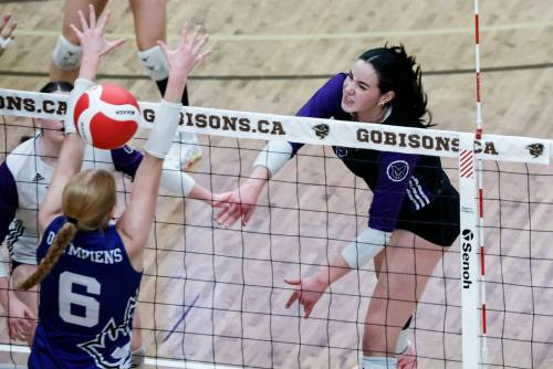 JOHN WOODS / WINNIPEG FREE PRESS
                                Vincent Massey&rsquo;s Hannah McGregor (right) scores the winning point against the Jeanne-Sauvé Olympiens Monday in the varsity girls provincial volleyball championship.