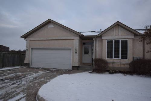 The spacious bungalow condo offers a contemporary updated interior and great location.