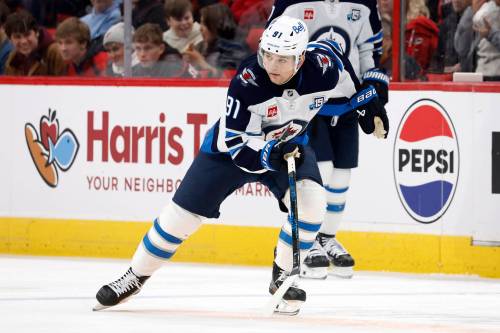 Karl DeBlaker / THE ASSOCIATED PRESS FILES
                                Winnipeg Jets winger Cole Perfetti suffered a high-ankle sprain in an exhibition game against the Calgary Flames back in October.