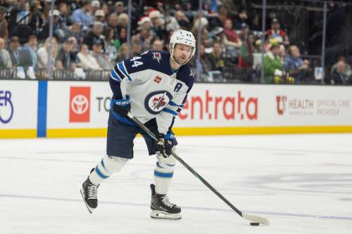 MELISSA MAJCHRZAK / ASSOCIATED PRESS FILES
                                Winnipeg Jets defenseman Josh Morrissey moves the puck against the Utah Mammoth during the second period of a Dec. 21 game in Salt Lake City. (AP Photo/Melissa Majchrzak)