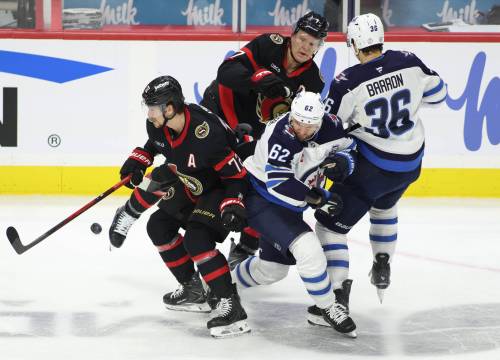 Patrick Doyle / THE CANADIAN PRESS
                                Ottawa Senators&rsquo; Thomas Chabot (72), Winnipeg Jets&rsquo; Nino Niederreiter (62), Senators&rsquo; Brady Tkachuk (7), and Jets&rsquo; Morgan Barron (36) battle for the puck in the second period in Ottawa on Saturday.