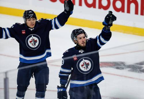 JOHN WOODS / FREE PRESS FILES
                                Danny Zhilkin (right) celebrates his goal with Kevin He in pre-season action in September.