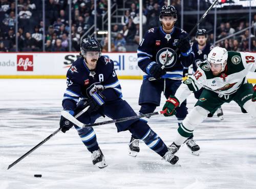 John Woods / THE CANADIAN PRESS FILES
                                One option Winnipeg Jets head coach Scott Arniel is yet to try is splitting up forwards Mark Scheifele (left) and Kyle Connor (centre) in an effort to try and have each player drive their own lines.