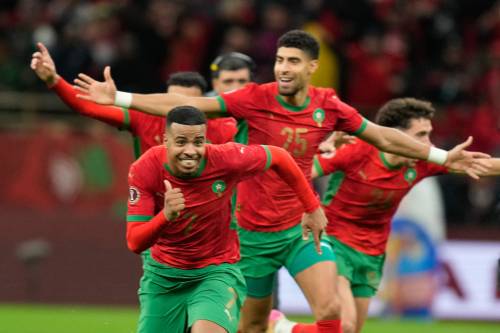 MOSA&rsquo;AB ELSHAMY / THE ASSOCIATED PRESS
                                Morocco players celebrate after winning their semifinal match against Nigeria in a shootout Wednesday. The host nation will battle for the African Cup of Nations title Sunday against Senegal.