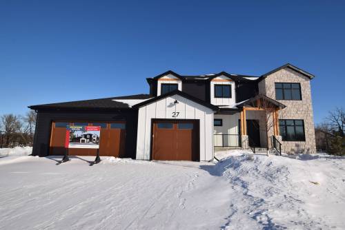 Offering a combination of river views, functionality and refined style, the two-storey, 2,875-sq.-ft. home is a modern farmhouse masterpiece.