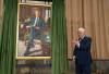 Former prime minister Stephen Harper gestures to the artist after he unveiled his official portrait during a ceremony in Ottawa, on Tuesday. (Adrian Wyld / The Canadian Press)