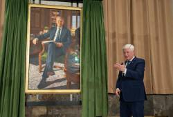 Former prime minister Stephen Harper gestures to the artist after he unveiled his official portrait during a ceremony in Ottawa, on Tuesday. (Adrian Wyld / The Canadian Press)