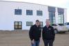 AgWest Brandon branch manager Derek Papineau (right) stands in front of the new facility with his assistant, Mike Noto. (Abiola Odutola / The Brandon Sun files)