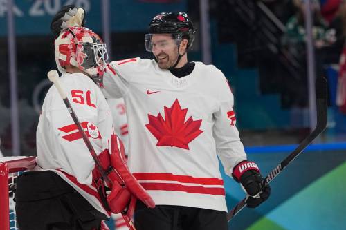 Petr David Josek / The Associated Press
                                Winnipegs Mark Stone (right) scored his first Olympic goal, the second on the night for Canada, and Jordan Binnington (left) recorded his first Olympic shutout in Canada&rsquo;s 5-0 win over Czechia Thursday in Milan.