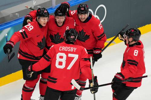Hassan Ammar / THE ASSOCIATED PRESS
                                Team Canada forward Connor McDavid (back row, centre) opened the scoring for Canada against Switzerland on Friday in Milan.