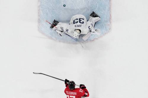 Canada&rsquo;s Macklin Celebrini (17) scores on a penalty shot in the second period against France&rsquo;s goalkeeper Julian Junca (33) during a preliminary round game of men&rsquo;s ice hockey between Canada and France on Sunday. (Carolyn Kaster/The Associated Press)
