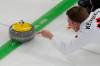 Canada&rsquo;s Marc Kennedy delivers the stone during a men&rsquo;s curling round robin match against China at the 2026 Winter Olympics, in Cortina d&rsquo;Ampezzo, Italy, on Sunday. (David J. Phillip / The Associated Press)