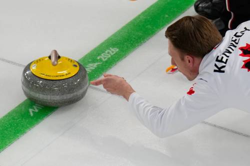 Canada&rsquo;s Marc Kennedy delivers the stone during a men&rsquo;s curling round robin match against China at the 2026 Winter Olympics, in Cortina d&rsquo;Ampezzo, Italy, on Sunday. (David J. Phillip / The Associated Press)