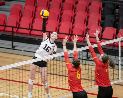 BROOK JONES/FREE PRESS
                                University of Winnipeg Wesmen left side Brooke Duncalf spikes the ball while Calgary Dinos&rsquo; Narelle Arnold (No. 6) and teammate Leni Blanke (No. 1) go up for a block during first set action at the Canada West Women&rsquo;s Play-In Game 1 at the Duckworth Centre, Thursday. The Wesmen earned a 3-0 victory over the Dinos.
