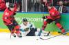 HASSAN AMMAR / THE ASSOCIATED PRESS
                                Elkhorn&rsquo;s Travis Sanheim (right) teed up Shea Theodore&rsquo;s game-tying goal Friday against Finland.