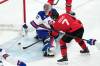 Carolyn Kaster / The Associated Press
                                United States goalkeeper Connor Hellebuyck uses his stick to block a shot by Canada&rsquo;s Devon Toews during the third period of the men&rsquo;s ice hockey gold medal game at the 2026 Winter Olympics, Feb. 22.