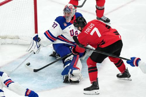 Carolyn Kaster / The Associated Press
                                United States goalkeeper Connor Hellebuyck uses his stick to block a shot by Canada&rsquo;s Devon Toews during the third period of the men&rsquo;s ice hockey gold medal game at the 2026 Winter Olympics, Feb. 22.