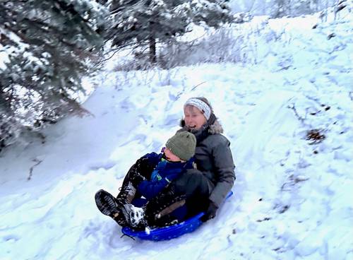 Gord Mackintosh / Free Press
                                The unstoppable Henry and Margie Mackintosh sled down a hill across from our West Hawk Lake Resort cabin.