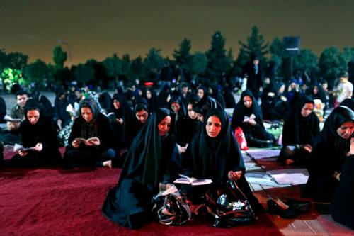 Ebrahim Noroozi / The Associated Press files
                                Iranian women pray during a ceremony marking the anniversary of the death of Imam Ali, the first Imam of Shia Muslims, near Tehran.