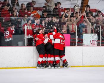 DAVE WILLSON PHOTO
                                The Glenlawn Lions girls&rsquo; hockey team celebrates its 5-1 Game 2 win over the Vincent Massey Trojans Thursday to claim the MWHSHL Division 1 title.