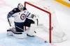 CHARLES KRUPA / THE ASSOCIATED PRESS
                                Winnipeg Jets goaltender Connor Hellebuyck slides the puck out of the net after the Boston Bruins fifth goal Thursday night.