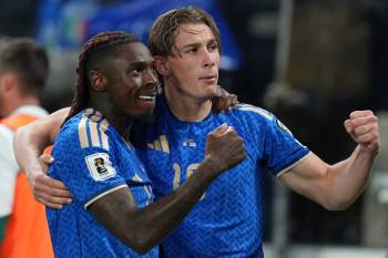 Antonio Calanni / THE ASSOCIATED PRESS
                                Italy&rsquo;s Moise Kean (left) and teammate Francesco Pio Esposito celebrate after Kean scored Italy&rsquo;s second goal during the World Cup semifinal qualifying match Thursday against Northern Ireland.