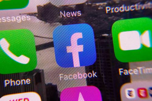 AP Photo / Richard Drew
                                The Facebook app is shown on a mobile phone screen.