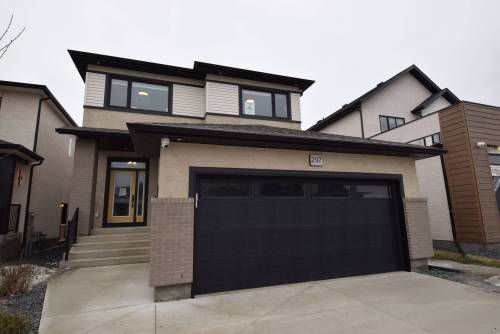 TODD LEWYS / FREE PRESS
                                The efficiently designed Florence model proves a home need not be over 2,000 sq. ft. in size to offer the functionality families require.