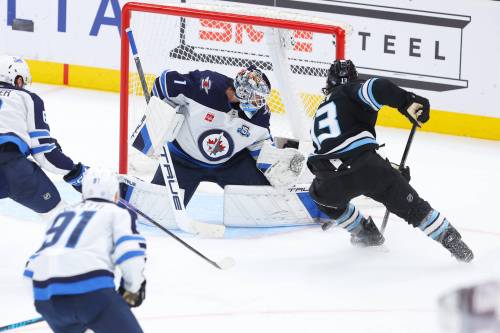 Melissa Majchrzak / The Associated Press
                                Winnipeg Jets goalie Eric Comrie stops a shot by Utah Mammoth left wing Brandon Tanev during the second period of the Jets 5-3 loss, Tuesday in Salt Lake City.