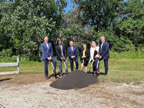 GABRIELLE PICHE / FREE PRESS
                                From left: Tyler MacAfee, the Winnipeg Airports Authority&rsquo;s vice-president of external affairs; Economic Development Minister Jamie Moses; Winnipeg Mayor Scott Gillingham; Transportation and Infrastructure Minister Lisa Naylor; Carly Edmundson, president of CentrePort Canada; and Coun. Evan Duncan (Charleswood-Tuxedo-Westwood) mark the ground-breaking of CentrePort South in August 2024.