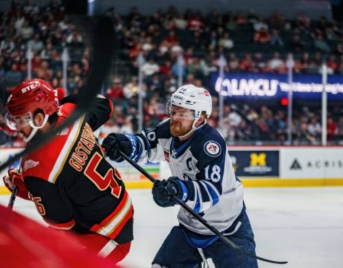 NICOLAS CARRILLO PHOTO
                                Manitoba Moose forward Mason Shaw (right) closes in on Grand Rapids Griffins defenceman Erik Gustafsson during Game 3 of their Calder Cup playoff series in Michigan on Friday.