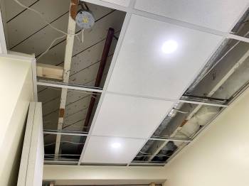 Once the L-bracket is mounted along the perimeter, the main supports and cross section create a grid for the floating tiles.
