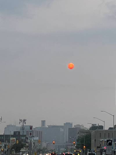 Russell Wangersky / Free Press Files
                                The sun behind forest fire smoke over Portage Avenue