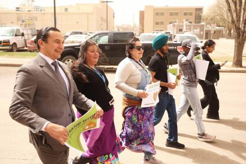 TIM SMITH / THE BRANDON SUN
                                Manitoba Premier Wab Kinew walks with other participants in the Moose Hide Campaign Community Walk in Brandon on Thursday.
