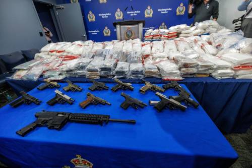 MIKE DEAL / FREE PRESS
                                A display of the seizure of over $37.2 million worth of drugs, 14 firearms, approximately $825,000 in currency and 1.35 million illegal cigarettes on May 20.